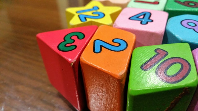 Montessori color tablets arranged on a mat, aiding color recognition and matching skills.